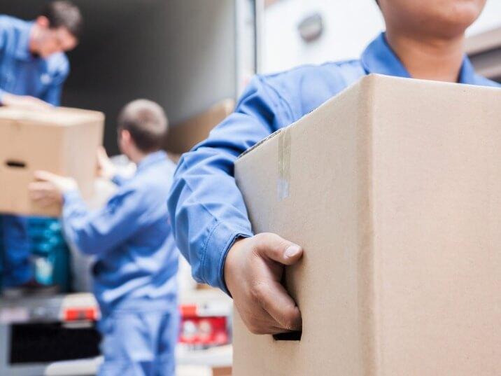 long row of identical moving boxes labeled with various addresses